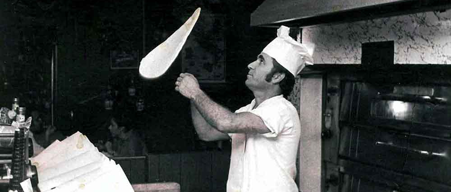 Tony Nonno Smecca tossing pizza dough at Mario's Seawall