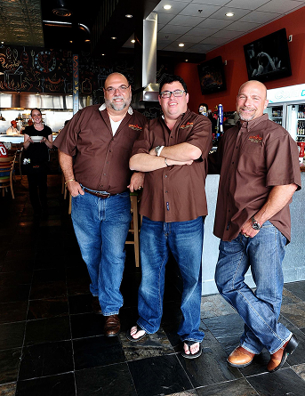 GRG restaurant staff posing inside one of their locations