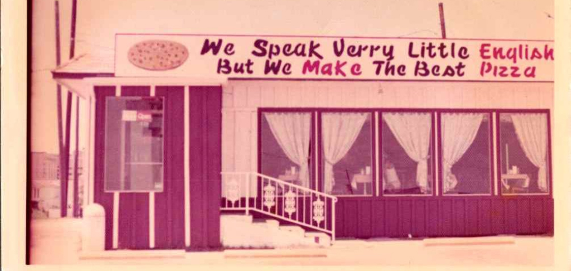 Original Mario's Seawall storefront in 1973 - We Speak Very Little English But We Make The Best Pizza